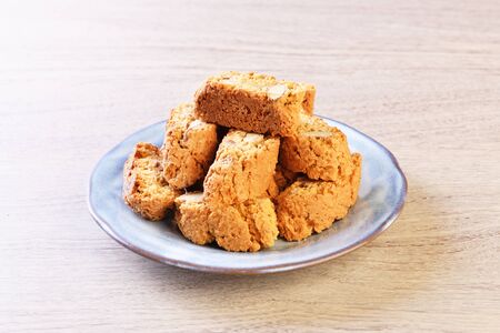 Classic Italian biscotti with almonds on wooden table