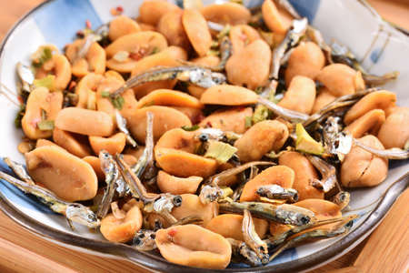 Peanuts & spicy scallion flavor fish on plate