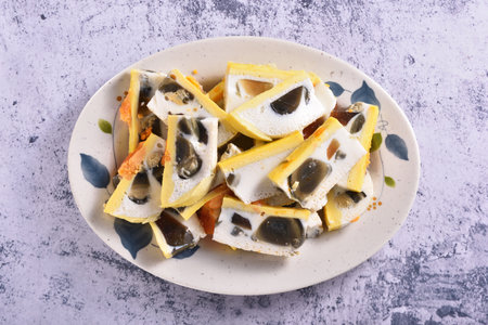 Sliced three-color eggs on the plateの写真素材