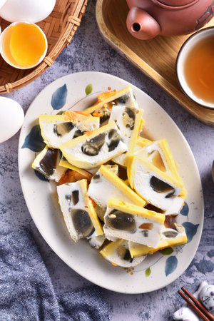 Sliced three-color eggs on the plateの写真素材