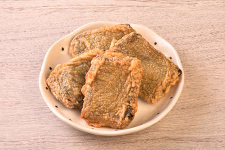 Black glutinous rice cake on the plateの写真素材