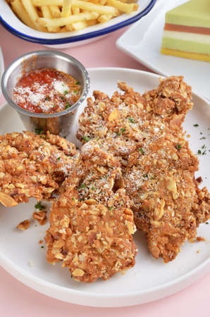 Yogurt oatmeal fried boneless chicken nuggets on a plateの写真素材
