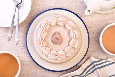 Delicious taro paste chiffon cake on wooden tableの写真素材