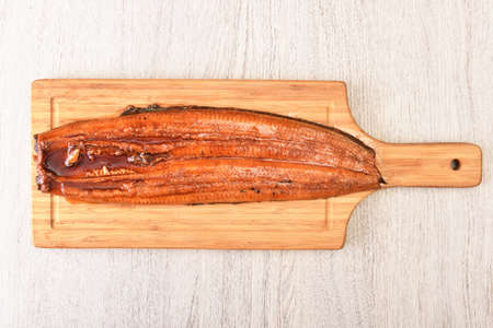 Grilled eel(grilled unagi) on the wooden cutting boardの写真素材