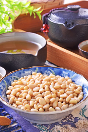 Pine nuts on the wooden table. Healthy food.の写真素材