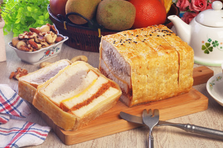 Crepes cake stuffed mush sweet taro and pork floss on wooden cutting board