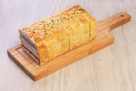 Crepes cake stuffed mush sweet taro and pork floss on wooden cutting board