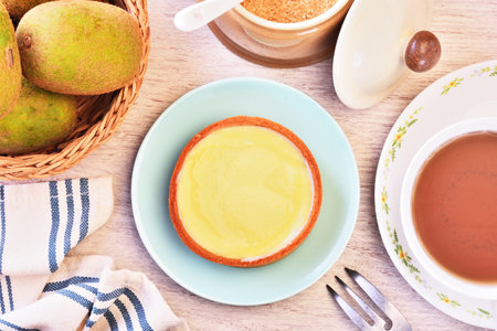 Lemon tart on a plate with hot teaの写真素材