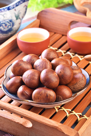 Grilled chestnuts on the plateの写真素材
