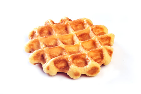 Belgian waffle on a white background, closeup of photoの写真素材