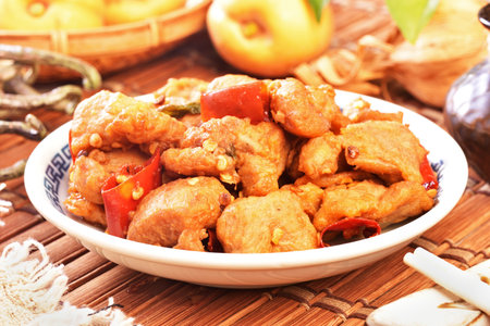 Spicy dice chicken on the plateの写真素材