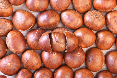 Chestnuts on a wooden background. Top view. Close-up.の写真素材
