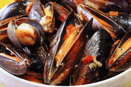 Mussels in cream cheese sauce and garlic.の写真素材