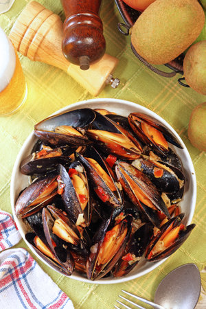 Mussels in cream cheese sauce and garlic.の写真素材