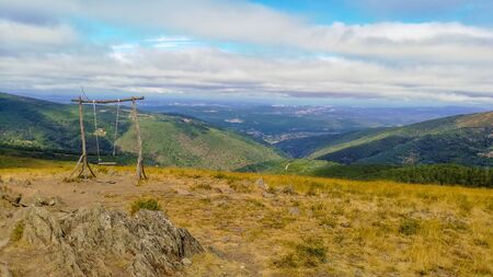 Swing overseeing a wide landscape in Mirando do Corvo, Portugalの写真素材