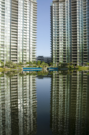 Tranquil lake with reflection of building and sky - the heaven reflection of lake in Ipoh, Malaysiaのeditorial素材