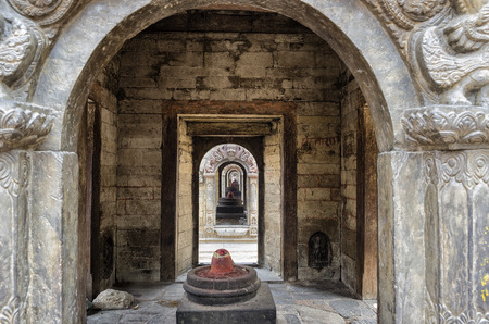Seeing throug the row of votive temples and shrines at Pashupatinath Temple, Kathmandu, Nepal - Sri Pashupatinath Temple located on the banks of the Bagmati River.の写真素材