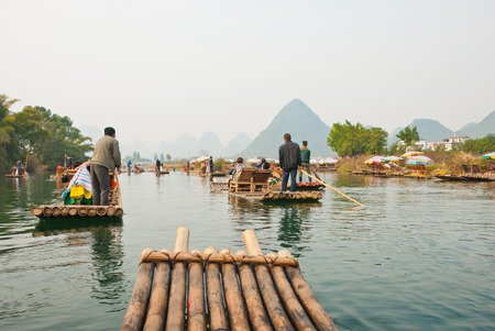 Bamboo rafting along YuLong, Guilin, China - Bamboo rafting along Yulong River during the winter season with beauty of the landscape is a popular activity in Guilinのeditorial素材