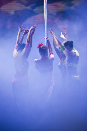 Pole Dance Performance - colourful lighting costumes pole dance performanceのeditorial素材