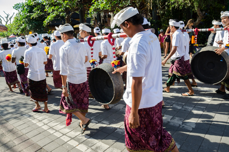 Balinese villagers participating in traditional religious Hindu procession before Ogoh-ogoh parade and Nyepi day (Balinese New Year) in Ubud, Bali, Indonesiaのeditorial素材