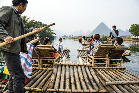 Bamboo raftign along YuLong, Guilin, China - Bamboo rafting along Yulong River during the winter season with beauty of the landscape is a popular activity in Guilinのeditorial素材