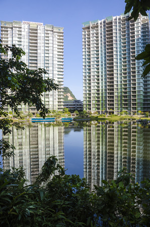 Tranquil lake with reflection of building and sky - the heaven reflection of lake in Ipoh, Malaysiaのeditorial素材