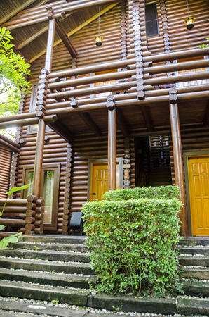 Log house - Cozy log house amongst green environment.のeditorial素材