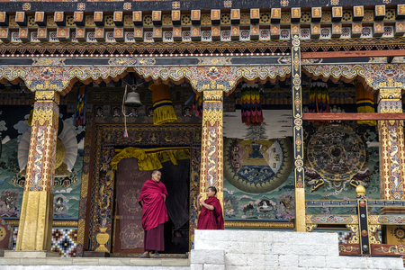 An senior and junior monk on discussion during the break time at Tashichho Dzong, Bhutanのeditorial素材
