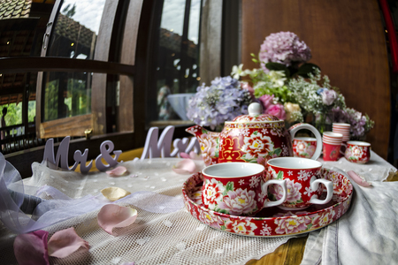 Traditional Chinese tea ceremony cups and tray in wedding day with the symbol known as "Double Happiness" - Chinese Tea ceremony is performed during a Chinese wedding or Chinese New Yearの写真素材