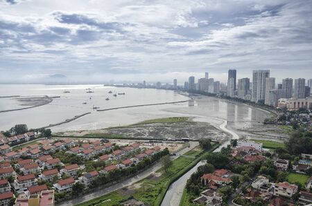 Scenic view of Gurney Drive with land reclamation activities, Penang, Malaysia. Gurney Drive is a popular seafront promenade within George Town, Penang, Malaysiaの写真素材