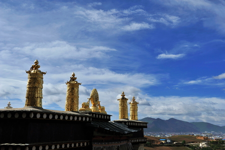 Figurine on the top of buildingの写真素材