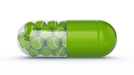 capsule with tennis ballsの写真素材