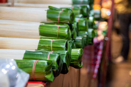 Khao Lam at the side stall behind bokeh and people