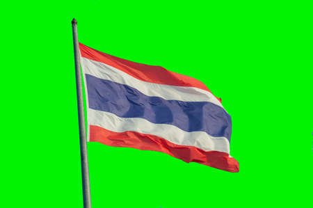 Thai flag on top of pole on green background