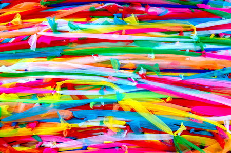 Multi colored fabric tied togetherの写真素材