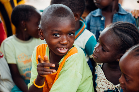 Mali, Africa - circa August 2009 - Black african children looking at camera in a rural village near Bamako.のeditorial素材