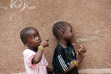Mali, Africa - circa August 2009 -   Two black african sisters having fun living in a rural area near Bamakoのeditorial素材