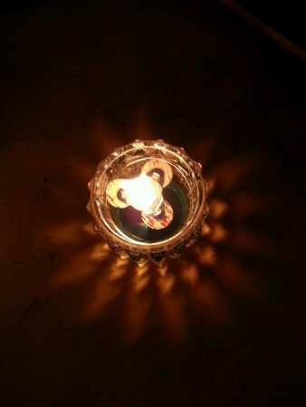 Aerial view of lit candleの素材