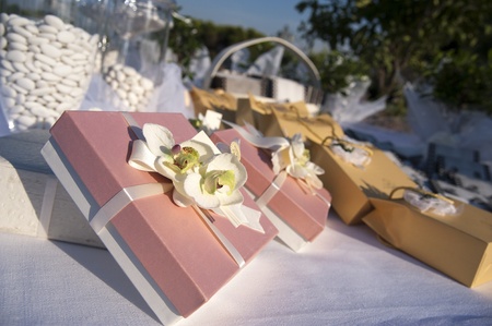 favors on a table outdoor with boxes for weddingの写真素材