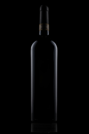 red wine bottle shoot on black backgroundの写真素材