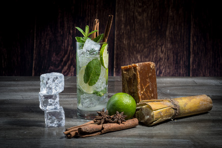 fresh mojito in a transparent glass on wooden backgroundの写真素材