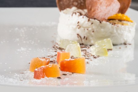 sicilian cannoli broken down on white dish and wooden backgroundの写真素材