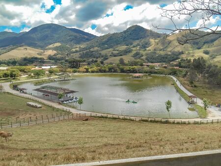 Lake in the mountains with trees and blue sky | Lake in the mountains with trees and blue skyの写真素材