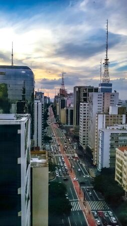 Big downtown at the begining of the night with blue and orange sky | Big downtown at the begining of...