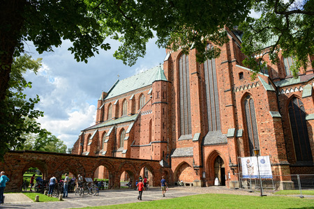 Bad Doberan, Germany 13.08.2014: Outside of Doberan Minster (Germany). People walking outside at Bad Doberan Minster in summertime.のeditorial素材