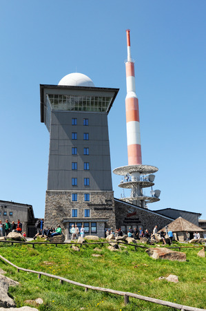BROCKEN MOUNTAIN, SAXONY-ANHALT / GERMANY May 26 2012: People visiting Brocken Mountain National Park at resin (Germany). On the peak are the typical red white communication tower and a hotel. Hiking people walking around on peak.のeditorial素材