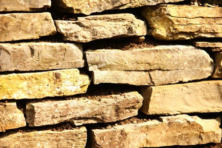 natural background of a limestone wall. vintage retouch of image.