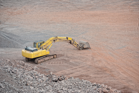 earth mover in a Porphyry rock quarry. mining industry