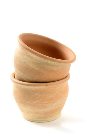 terracotta flowerpot on white isolated background. gardening, planting backgroundの写真素材