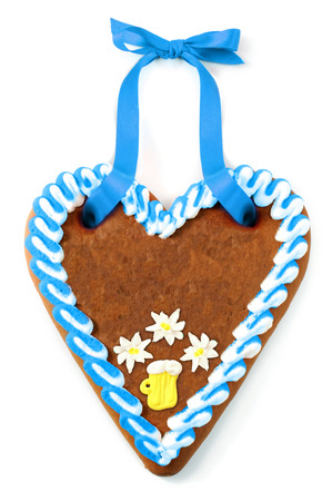 Oktoberfest gingerbread heart cake with copy space on white isolated backgroundの写真素材